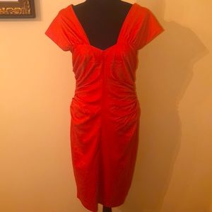 Get noticed in this chic midi cocktail dress. Gorgeous color